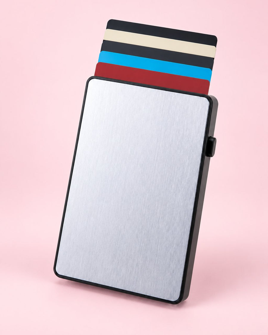 Silver aluminium pop-up card holder with plain cards fanned out of the top