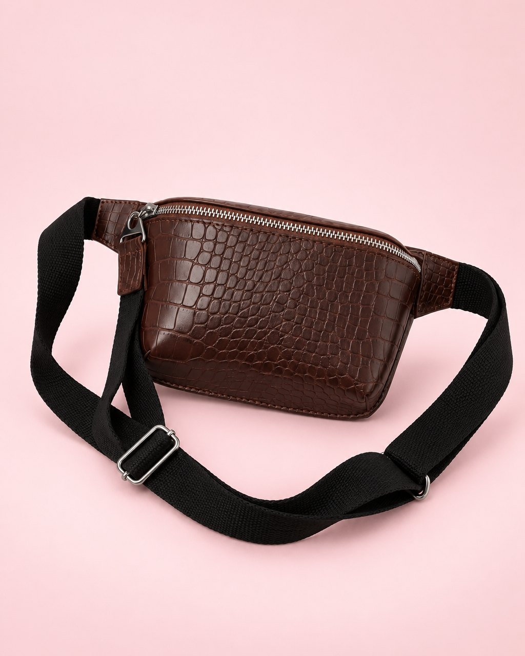 Coffee-brown croc-embossed belt bag with a wide black strap