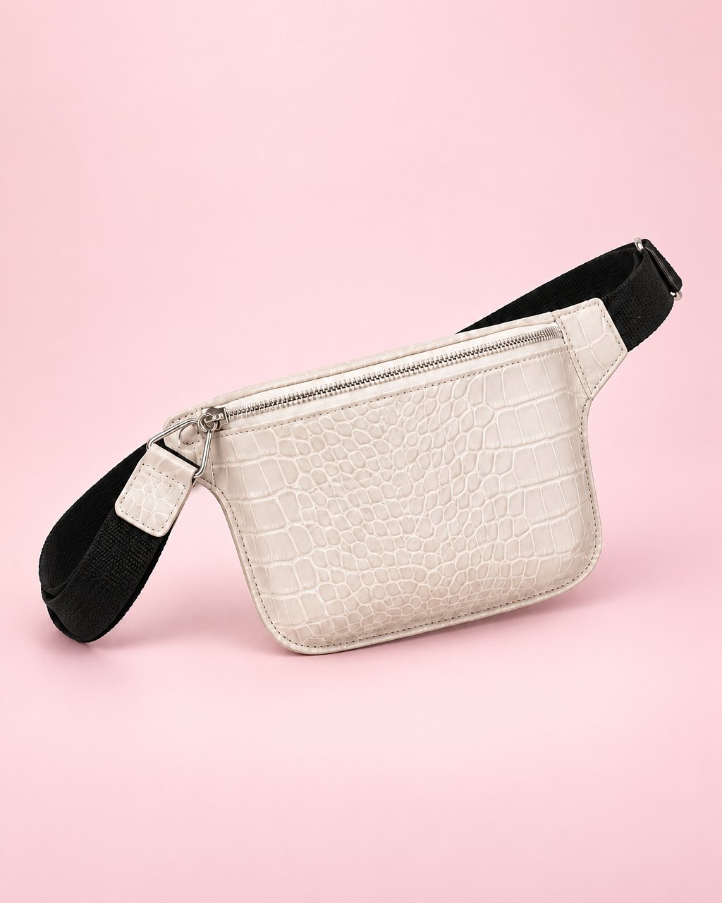 White croc-embossed belt bag with a wide black strap