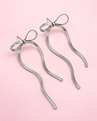 Silver-tone chain bow earrings with long, flat chain tails