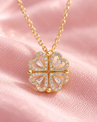 Close-up of the stone-edged hearts, their baguette centre stones and the small round beads where they join