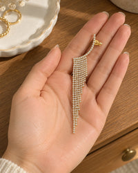 One ear climber lying on an open palm beside a small ring dish, showing its length