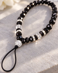 Close-up of the faceted black crystal beads, sparkly spacers and the thin cord loop