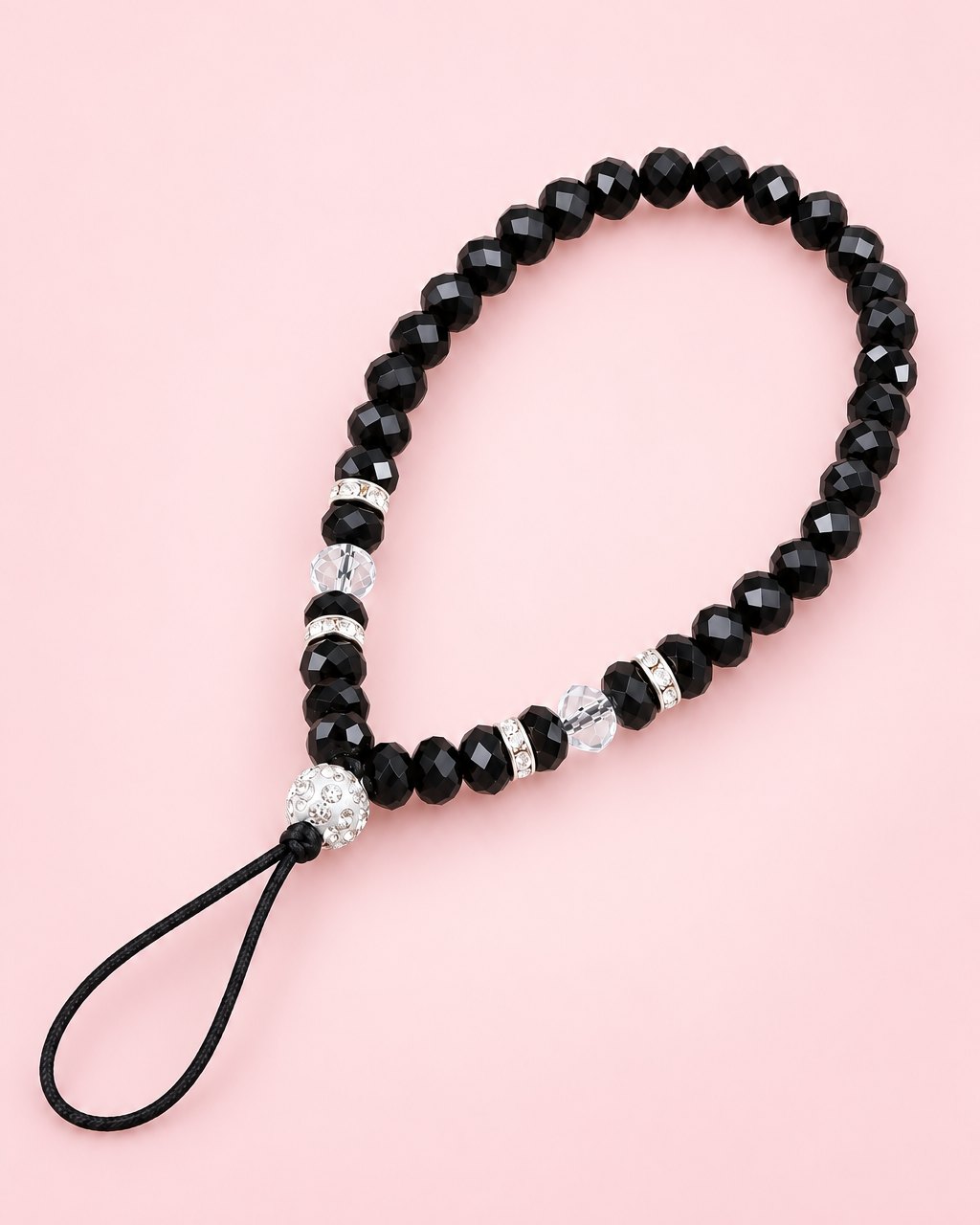 Black crystal bead phone wrist strap with a sparkly ball bead and thin cord loop
