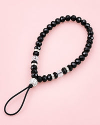 Black crystal bead phone wrist strap with a sparkly ball bead and thin cord loop
