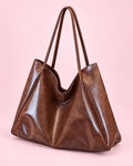 Brown glossy slouchy tote with two long shoulder straps