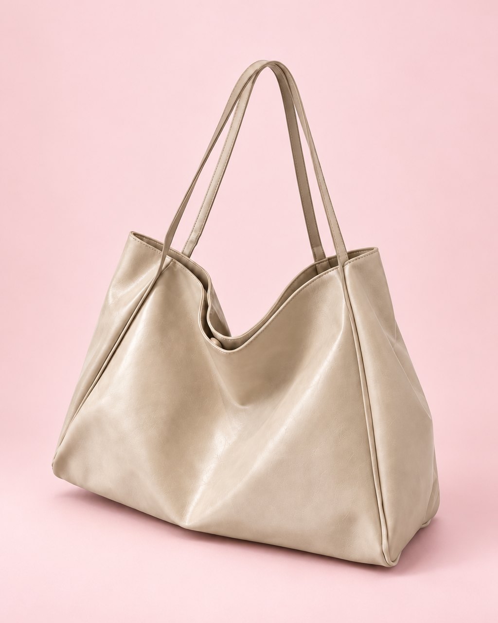 Beige glossy slouchy tote with two long shoulder straps