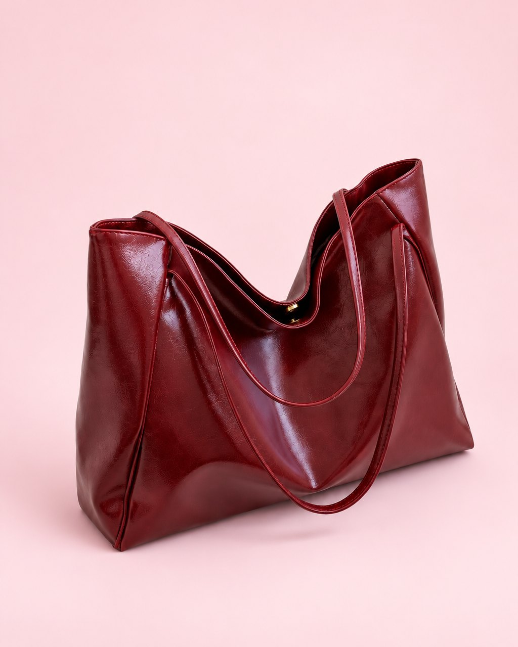 Burgundy glossy slouchy tote with two long shoulder straps