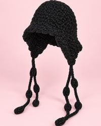 Black chunky hand-knit bonnet with long knotted ties