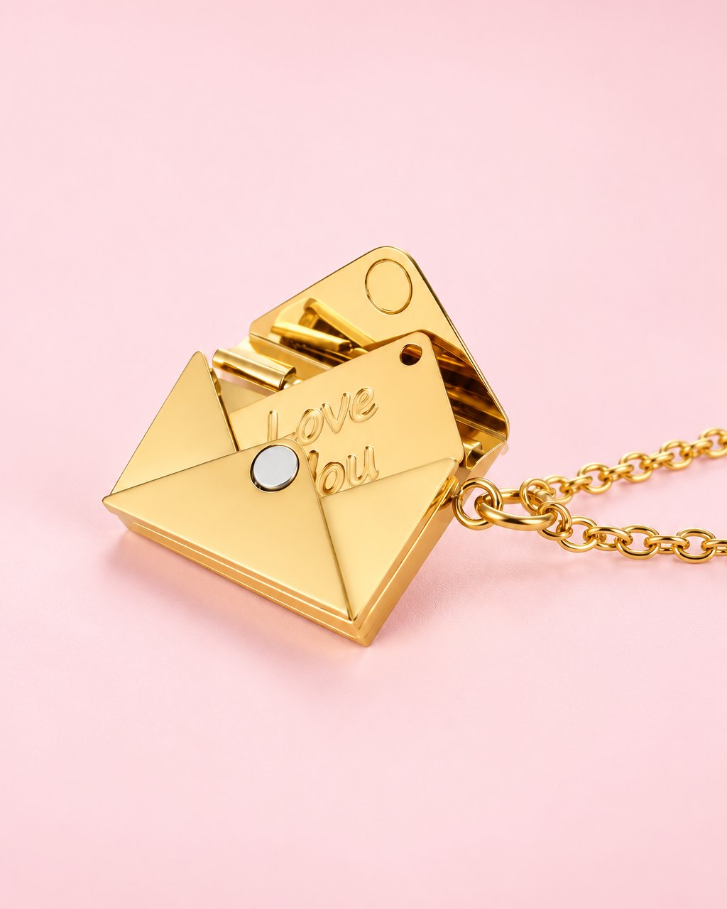 Gold-tone envelope pendant, open to show a tiny card engraved 'Love You', on a gold-tone chain