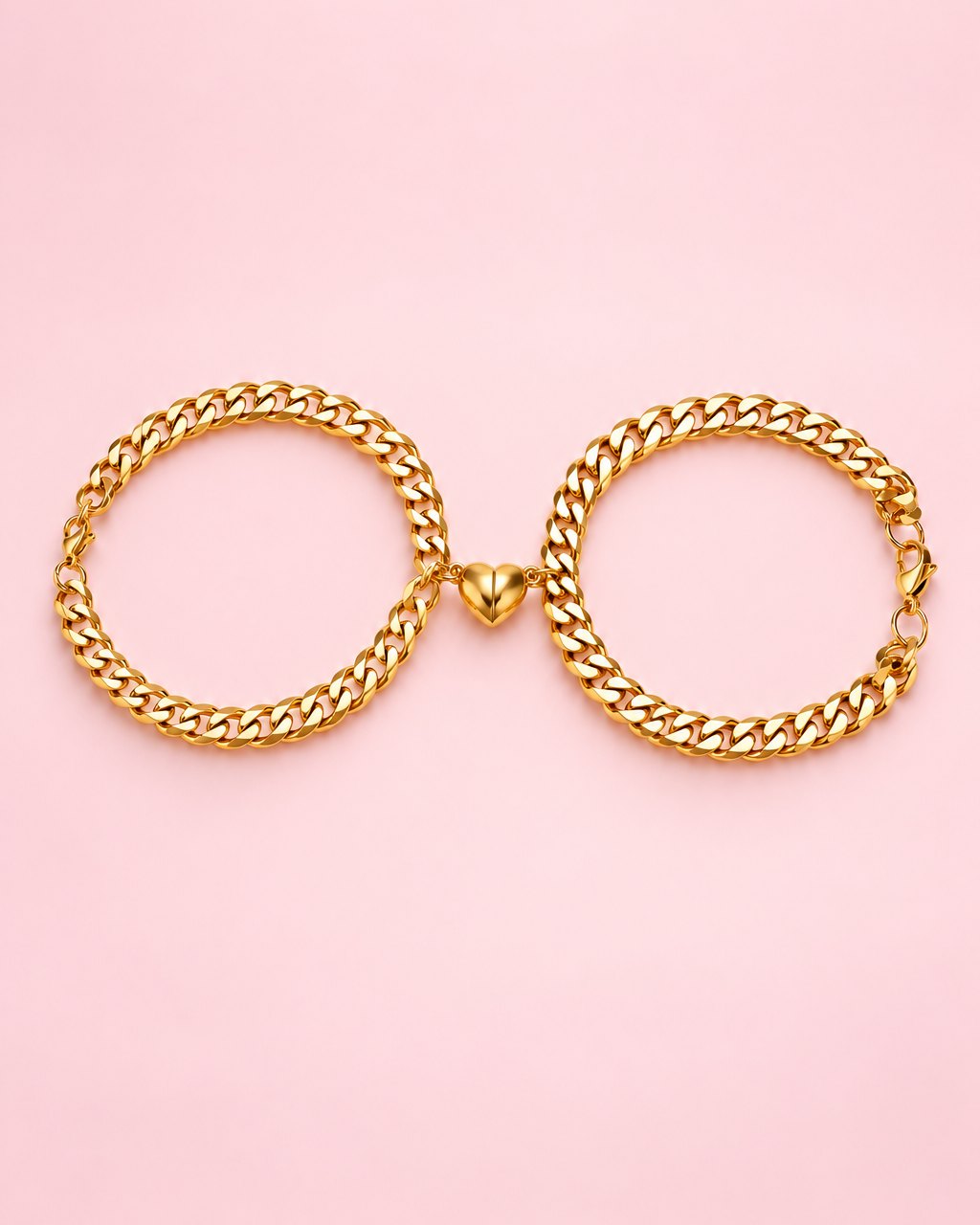Gold-tone pair of magnetic heart curb bracelets