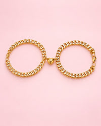 Gold-tone pair of magnetic heart curb bracelets