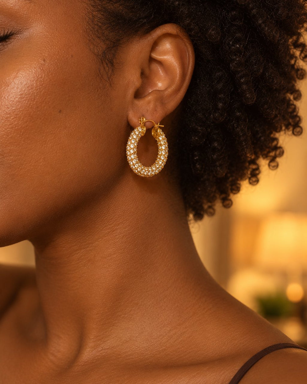 Woman with her hair pulled back wearing a sparkly 23 mm pavé hoop