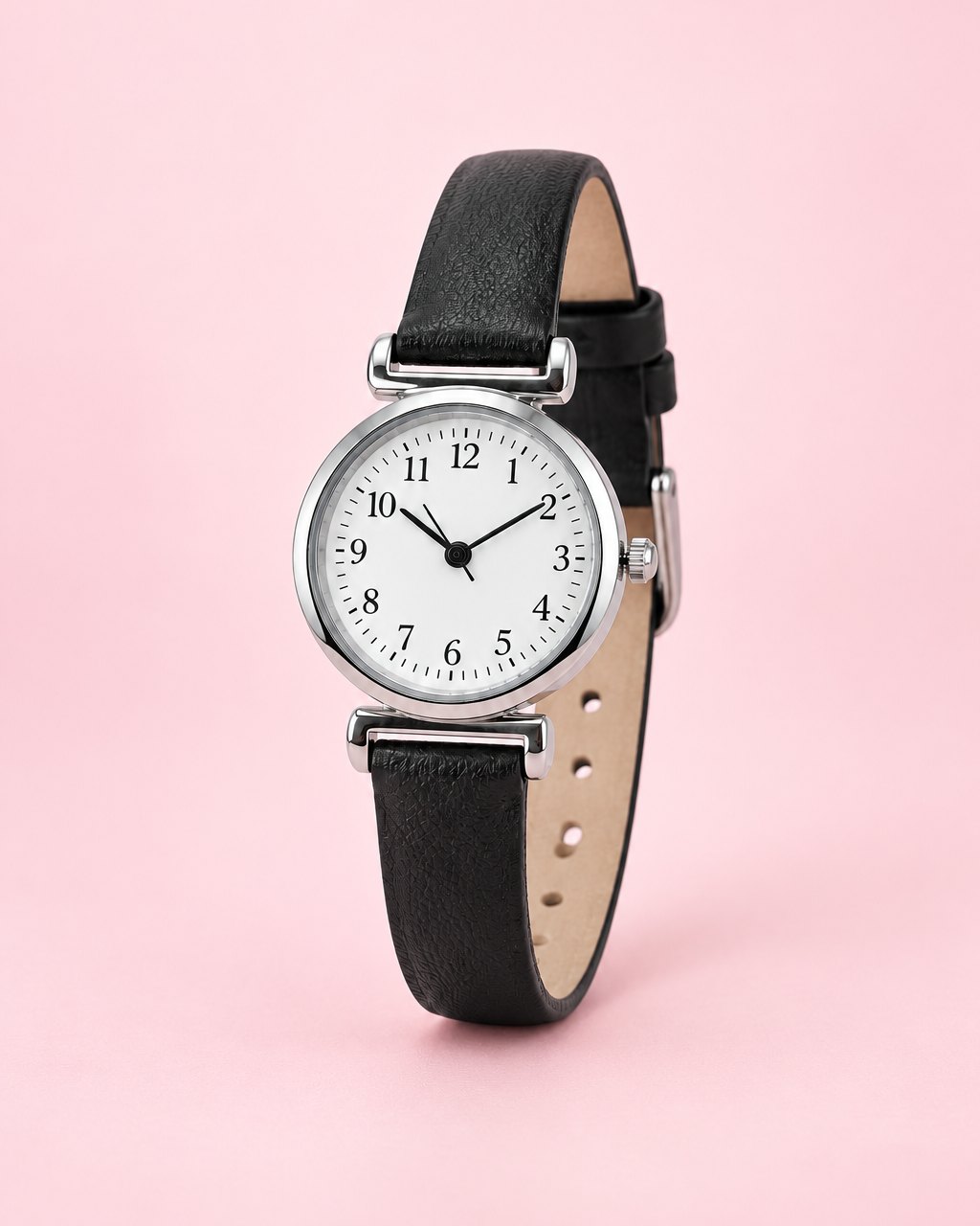 Petite silver-tone watch with a white numbered dial on a slim black strap