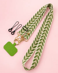 Cream woven phone strap with a green leaf pattern