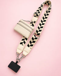 Cream phone strap with a black chevron weave and a cream zip pouch