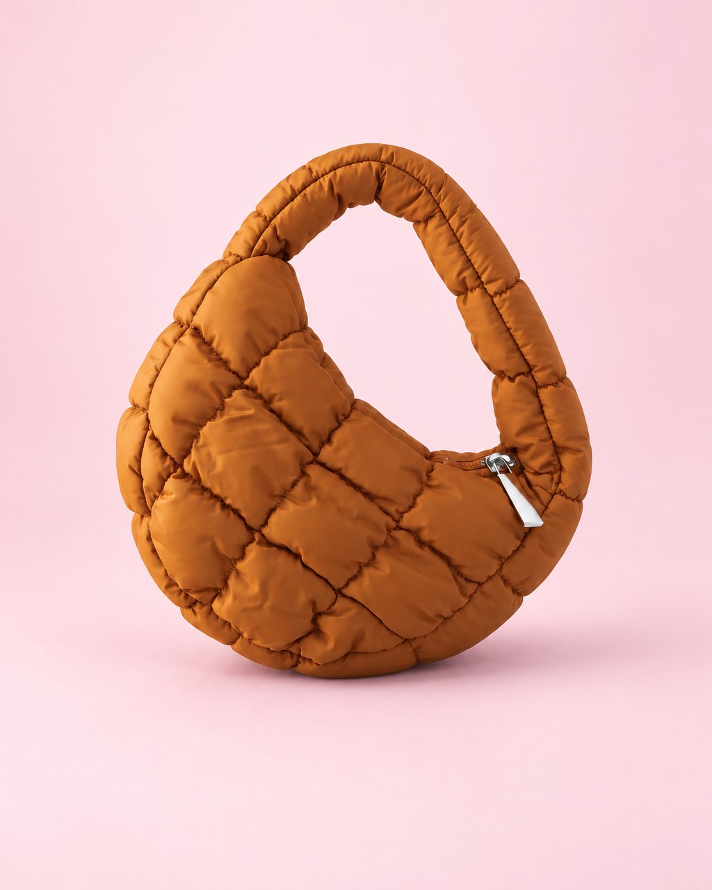 Caramel puffy quilted mini bag with a short top handle