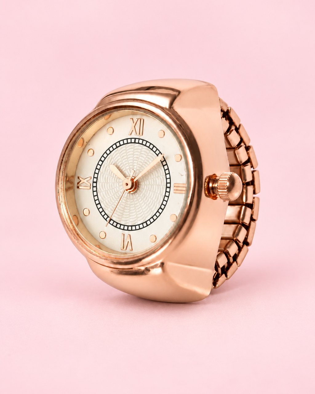Rose-gold-tone ring watch with a cream Roman numeral dial and a stretch link band