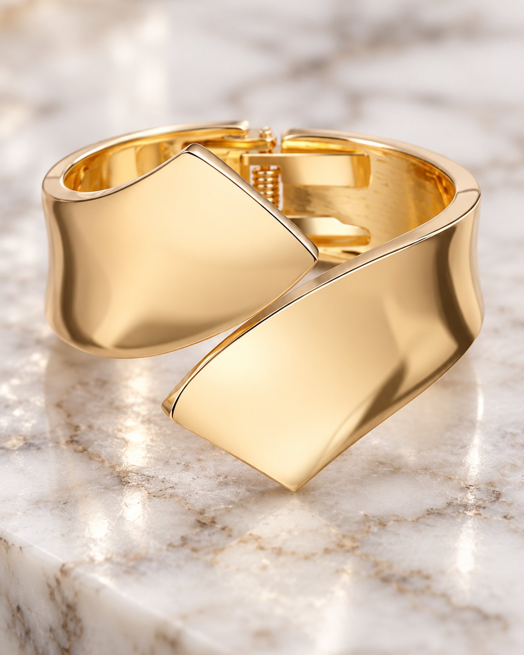 Close-up of the two mirror-polished folded ends crossing over on top of the cuff