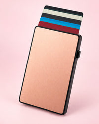 Rose-gold tone aluminium pop-up card holder