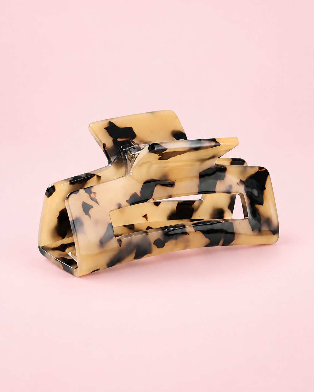Light tortoise acetate claw clip with an open rectangle shape