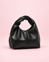 Black soft mini bag with a twisted top handle