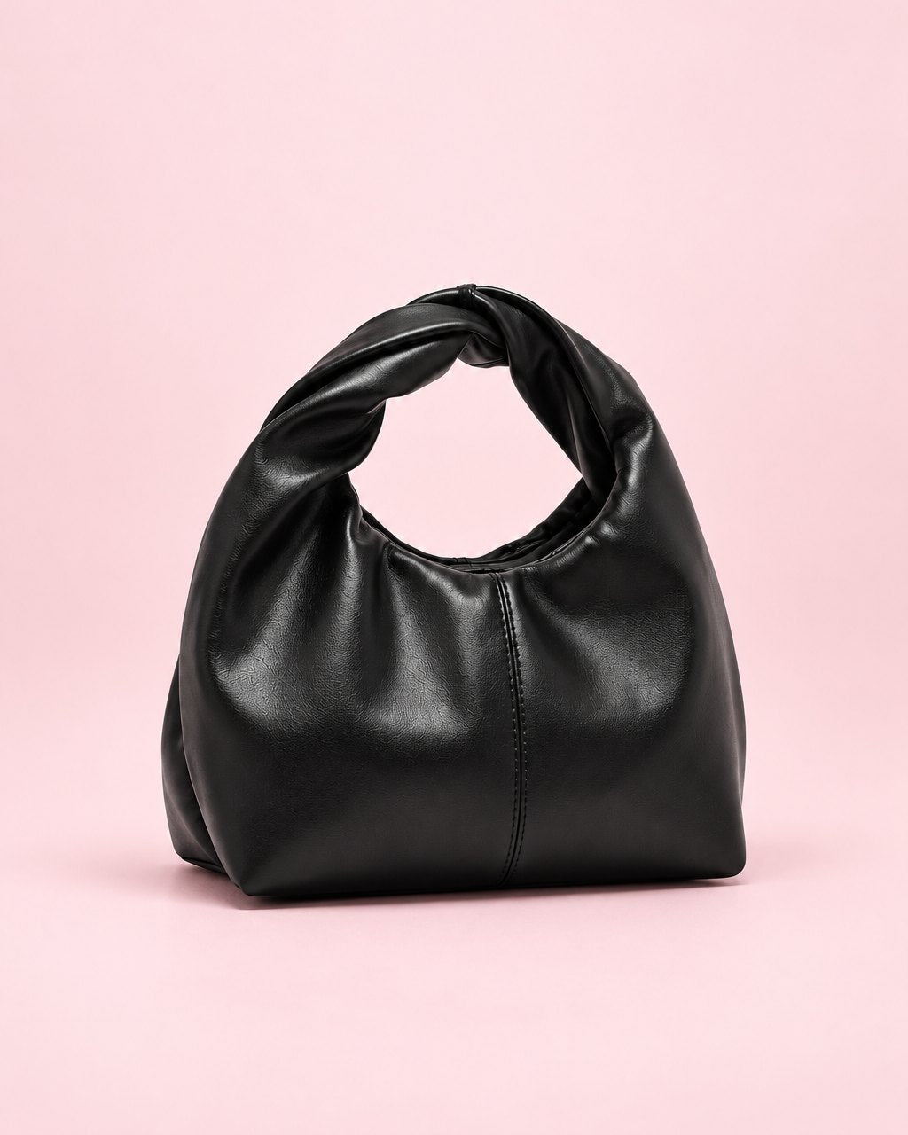 Black soft mini bag with a twisted top handle