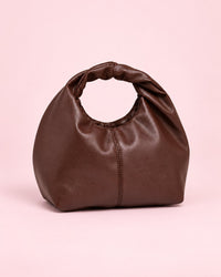 Brown soft mini bag with a twisted top handle