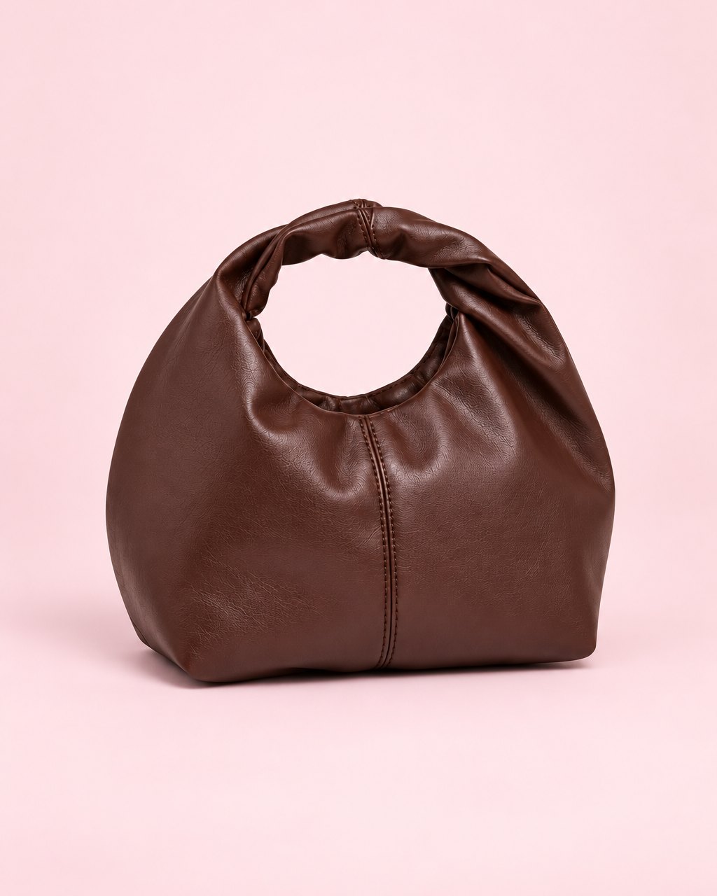 Brown soft mini bag with a twisted top handle